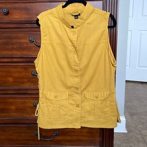 Large sleeveless cargo vest. Laces on the side. Tunic length.